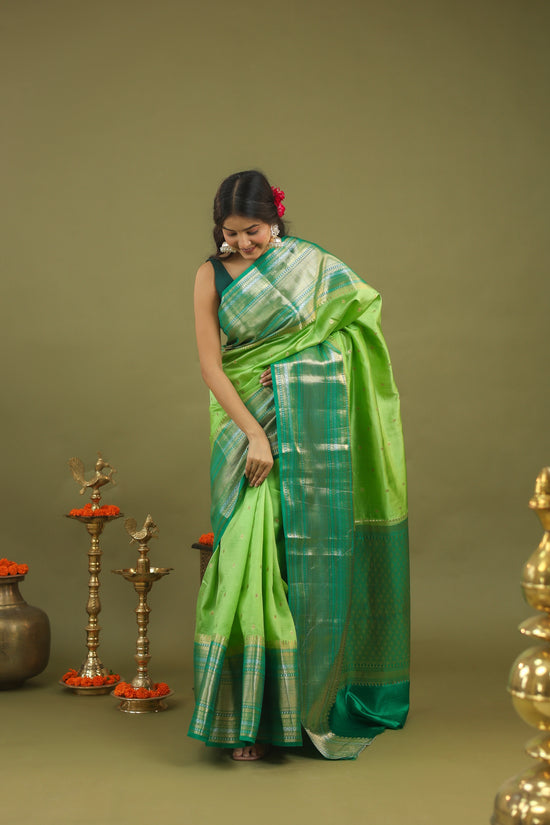 Pure Raw Mango Silk Banarasi Saree in Green & Teal with Silver Zari