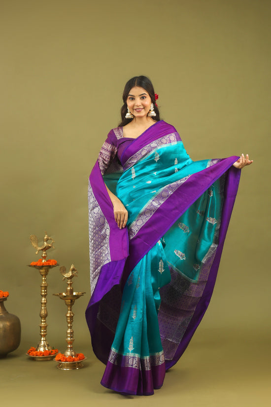 Regal Banarasi Raw Silk Saree in Teal Blue with Royal Purple Border & Silver Zari