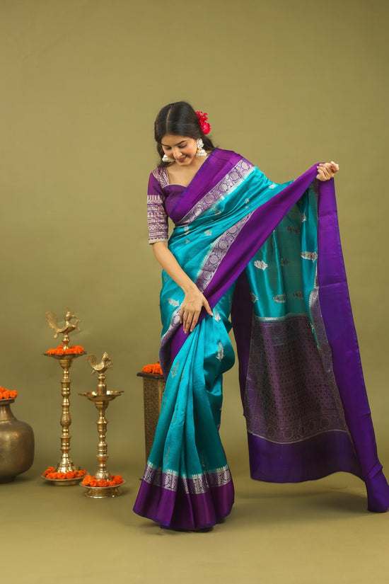 Regal Banarasi Raw Silk Saree in Teal Blue with Royal Purple Border & Silver Zari