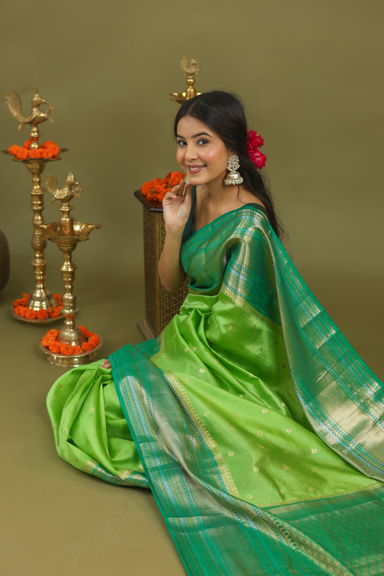 Pure Raw Mango Silk Banarasi Saree in Green & Teal with Silver Zari