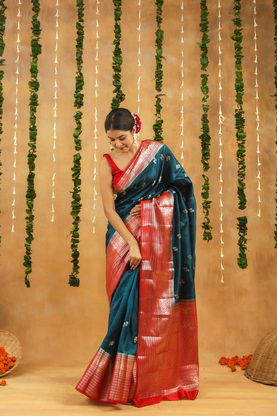 Handwoven royal teal Banarasi raw mango silk saree with crimson zari