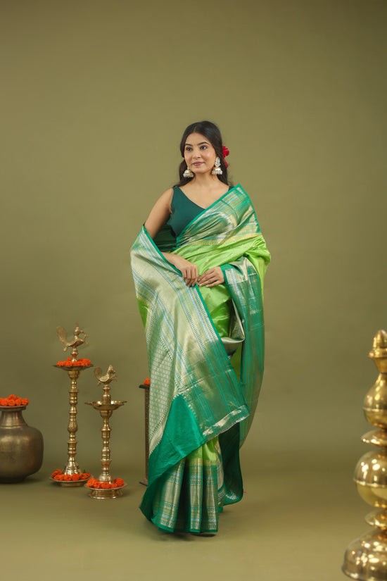 Pure Raw Mango Silk Banarasi Saree in Green & Teal with Silver Zari