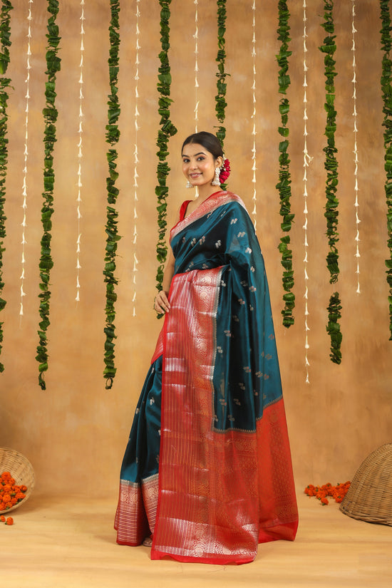 Handwoven royal teal Banarasi raw mango silk saree with crimson zari